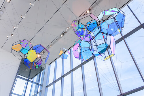 Tomás Saraceno (Argentine, b. 1973), Cosmic Filaments, 2019. Dichroic filters, polyacrylic panels, stainless steel, and polyester rope, 17'6" x 53' x 27'8". University purchase with funds from the William T. Kemper Foundation and Art on Campus Fund, 2019.