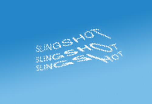 "Slingshot" written in white, dotted text on a blue sky